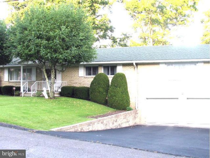 Don't miss this lovely rancher. A lg  living room, dining area and kitchen make a great place for families. Some hardwood under carpet. The addition over two car garage is a wonderful master bedroom with big walk-in closet and full bath.  The freshly painted deck, completely fenced back yard, work shop, laundry room, storage room  and shed completes this great home.  Call today for an appointment.