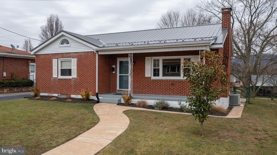 MOVE-IN READY RANCHER WITH LARGE, FENCED-IN BACKYARD! Welcome to 40 Memorial Avenue. This 3 bedroom, 2 bathroom brick rancher is located in the heart of South Cumberland and has many recent updates! The main floor features a spacious living room with recently re-finished hardwood floors and brick fireplace, an eat-in kitchen, three bedrooms and a full bathroom. Downstairs, the basement is partially finished with a laundry/storage area, a second full bathroom and a large room suitable to be a rec room, gym, etc. What makes this home unique? The yard space! This backyard is level, completely fenced-in, features a storage shed and provides ample space to enjoy the outdoors. There is off-street, asphalt parking that has recently been resurfaced. BRAND NEW metal roof put on in Fall 2024, hot water tank installed in October 2023, a new gas furnace installed two years ago as well as many lighting upgrades, fresh paint, etc. The majority of the windows have been replaced as well. Convenient to Downtown Cumberland, local schools and UPMC Western Maryland. DO NOT WAIT! Call today for more information.