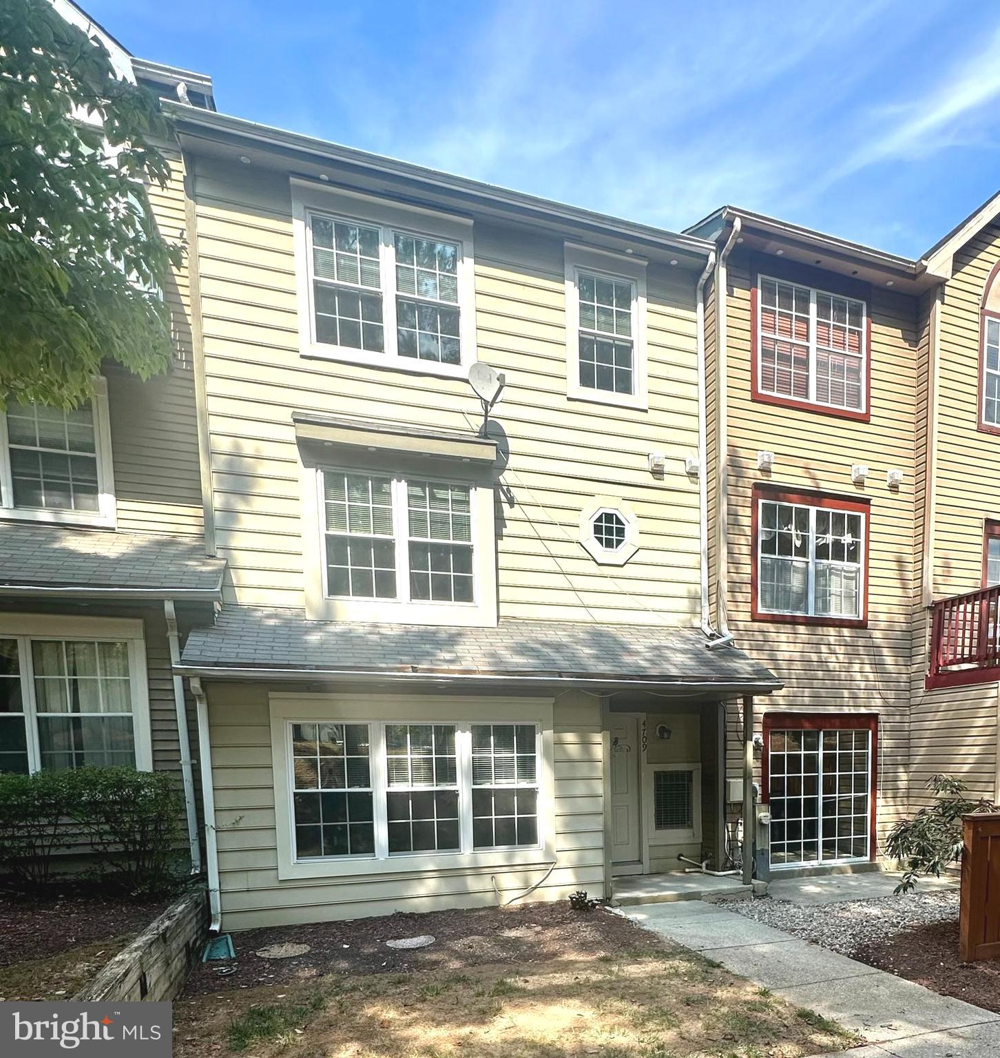 Open house Saturday 8-16-25 10am to 1pm. Welcome home to this three-level townhouse with 1,829 square feet of living space offering 4 bedrooms and 2 full and 1 half bathrooms. The home is professionally cleaned, shows very well and is ready for immediate occupancy! Greet your guests in the raised foyer with a formal coat closet and maintenance free laminate tile floors for easy upkeep. Step down to the formal living room and formal dining areas that have gorgeous vinyl plank wood floors and a ceiling fan. There is a great entertaining flow to the kitchen with a pass-through window that makes serving snacks and drinks a breeze. The wood cabinets have been freshly updated and there are newer quartz counters, a pantry and more laminate tile floors. The powder room is centrally located and is very convenient. The very large and private fourth bedroom (or family room) is adjacent to the entry foyer has newer carpet (2024), a walk-in closet and a sliding door that offers great natural light and easy access to the front patio area. The second and third levels have brand new carpet (2025) with upgraded padding. Wander your way to the first upper level and find yourself in the primary suite with four closets, a ceiling fan and an ensuite primary bathroom. There are ceramic tile floors, a beautiful standalone shower, and a large vanity with two sinks and another closet to help you stay organized. The laundry area is also on this level and there is another hall closet for more storage. The second upper level has a hall bathroom with a tub and shower combination, ceramic tile floors, a large hall storage closet, a linen closet and two more generous sized bedrooms. Almost everything is newer. The refrigerator (2019), HVAC and dryer (2020), washing machine and windows (2021), dishwasher (2022), kitchen counters, sink and garbage disposer, living and dining room floors, primary bath floors and shower, hall bath floors, and carpet in main level bedroom (2024). The private parking spot #53 is closest to the stairs and walkway and there is plenty of visitor parking for convenience. The walkway to the home is very well lit at night to provide security and peace of mind. There is a garden bed out front waiting for you to add your touch with flowers or herbs for cooking. The community outdoor pool provides family fun during the warmer months. The photos are from 2024 and do not depict the brand new (8-9-25) carpet on the stairs and upper two levels. This is not a pet friendly property.