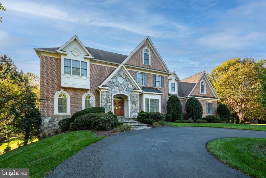 Discover the perfect blend of luxury and privacy in this stunning 7,000+ square foot brick and stone home nestled on a sprawling 1.8-acre fenced lot with mature landscaping in a quiet neighborhood. The possibilities are endless across three finished levels, featuring 5 bedrooms, 4 full baths, and 2 half baths. Custom Built by Foley Construction in 2006, this architectural gem greets you with a grand circular driveway and an oversized three-car garage. Step inside the two story foyer with grand staircase to find soaring 10-foot ceilings and gleaming hardwoods throughout the main level, with elegant formal living and dining rooms off the foyer. The main level features a chef’s kitchen with 13-foot ceilings, top-of-the-line appliances, durable ceramic tile, and a cozy morning room leading to a large sun-drenched family room with stone fireplace, making this space the heart of the home. This level also features custom touches such as a large home office with built-in shelving, custom built-in storage bench and lockers in the mudroom, butler’s pantry with custom cabinets, and a large brick patio overlooking a beautiful treed yard.

The second level houses a luxurious primary suite framed by large windows, which includes a spacious spa-like bathroom and two large walk-in closets. It also houses a convenient laundry room with commercial washer. Three other bedrooms, one with an en-suite bathroom and the other two with a shared bath, complete the second level. A curved open staircase leads to a finished walk-out lower level that is a true destination for entertainment and relaxation, boasting a full wet-bar (with sink, full sized refrigerator, and dishwasher), a dedicated workout room, a large recreation room with a stone fireplace, a billiard area (with pool table that stays for your first tournament), and a guest bedroom with a full bathroom. Outside you will find a lush, fully fenced-in yard enveloped by mature trees and landscaping that provides a peaceful and private sanctuary for play or simply enjoying nature. Whether you’re entertaining or enjoying a quiet night with family and friends, this home offers the perfect blend of space, privacy, nature, and custom finishes.

In addition to its custom craftsmanship, this home has been meticulously updated and maintained, including: new HVAC for all three floors (2018); fresh exterior paint (2026); comprehensive professional interior paint refresh (2026 & 2023); wall oven and microwave (2024); second floor carpeting (2021); main level recreation room hardwood floors (2021); work-out room flooring (2021); LED under-counter kitchen lights (2026); and well system (exterior well casing (2026); pump and controller (2016)).
