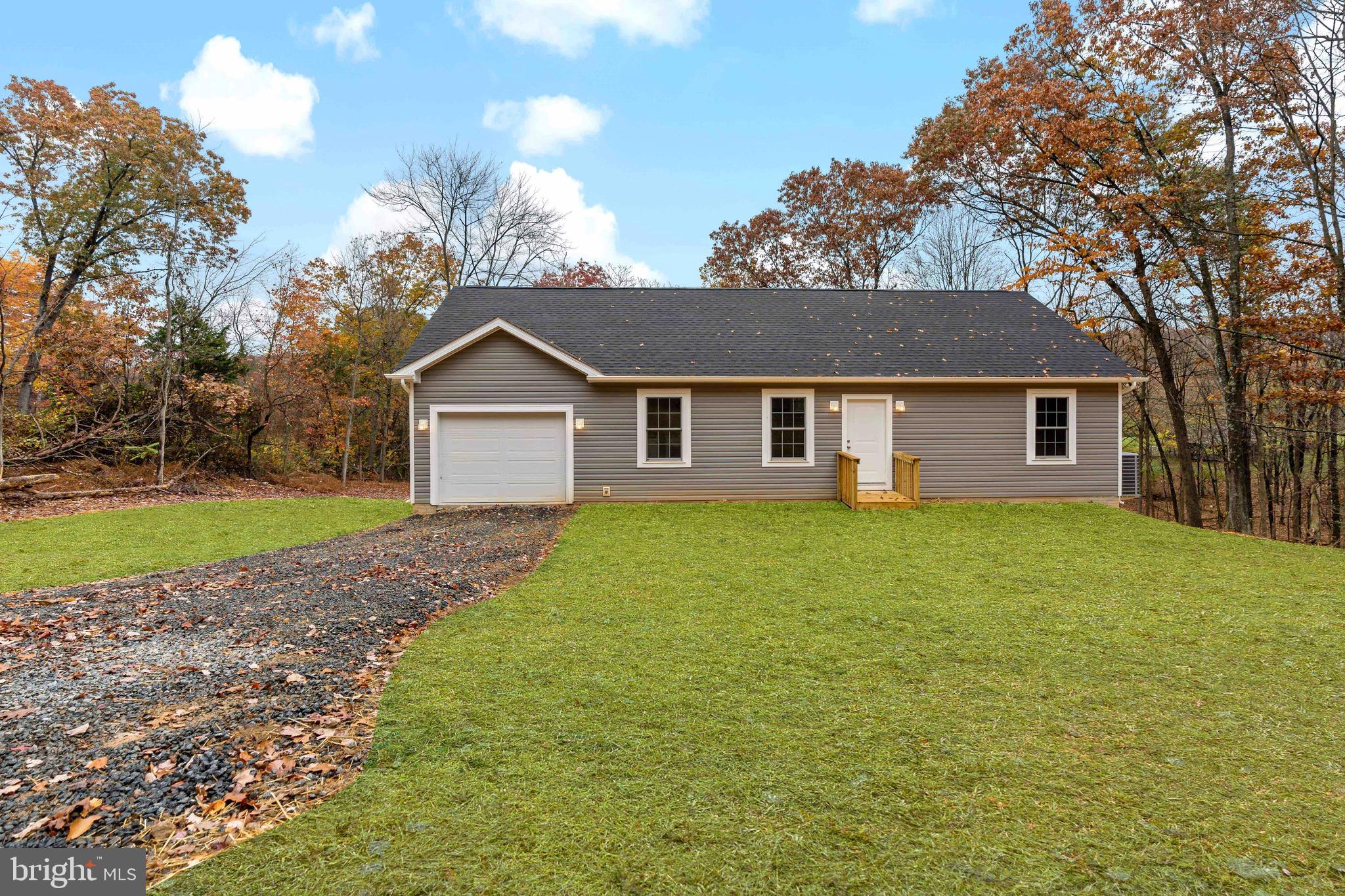 This newly constructed -turn key rancher is ready for its owners. Quality construction with affordable pricing , located in Berkeley Springs, WV. Home is situated on 2+ acres. Enjoy the beautiful mountain views from your back deck. 3 Bedroom, 2 bathroom, open concept home - with one level living, vaulted ceilings , LVP flooring through out the home, and an unfinished full basement. Upgraded stainless steel appliance package, kitchen island for all your extra cooking space, and granite counter tops are features in your kitchen. Tastefully painted neutral in all rooms, upgraded remote controls for ceiling fixtures, and so much more. Schedule your private tour today!