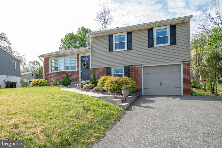 This beautifully maintained single-family home in the highly desirable Perkiomen Township offers a blend of modern upgrades and timeless charm. Situated on a quiet street, the property features a sunlit living room with gleaming hardwood floors and custom paint. Recent updates include new windows installed in 2022 (excluding the kitchen) and a new roof added in 2024. The remodeled kitchen boasts tile flooring, white cabinets, granite countertops, and newer appliances. An elegant dining room with bright sliding doors leads to a spacious backyard oasis, perfect for relaxation and entertaining. The fully finished basement serves as a versatile space, ideal for a family room, media, or game room, and includes plush carpeting, a powder room, and a separate laundry area. Upstairs, the immaculate bedrooms feature hardwood floors, custom paint, and ample closet space. Both bathrooms are updated with ceramic tile, modern sinks, and light fixtures. Additional highlights include maintenance-free siding, newer gutters and downspouts, a 200-amp electrical service, and an automatic garage door. Enjoy the expansive, lush backyard from the comfort of your covered back porch. Located just minutes from Skippack Village, Providence Town Center, and major routes like Rt. 29, 113, and 422, this home offers convenient access to shopping, dining, and entertainment options. Perkiomen Township's housing market remains strong, and the area is recognized as one of the top suburbs to buy a home in the Philadelphia region. Don't miss the opportunity to own this dream home in a thriving community!