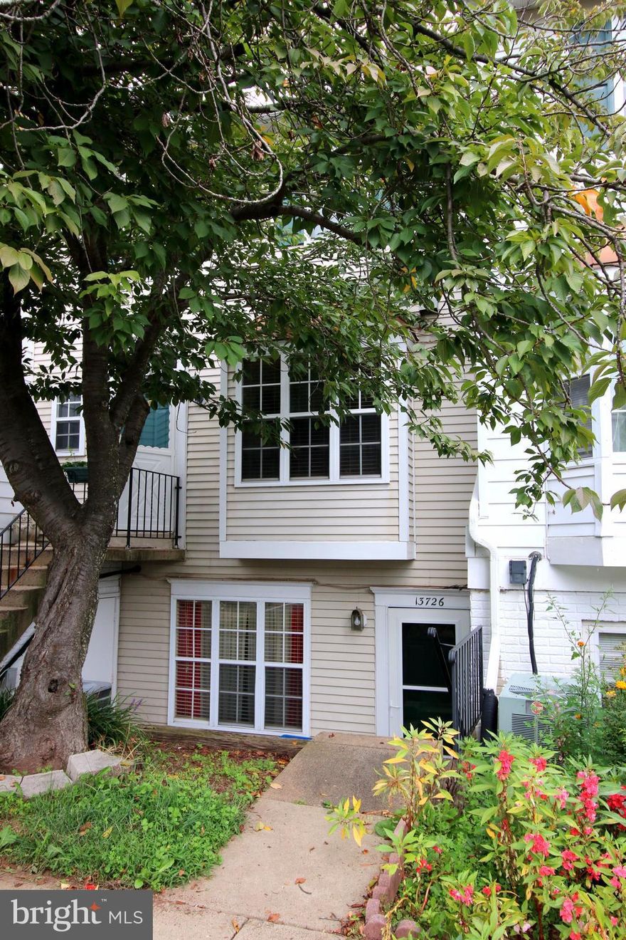 Condo close to everything!  Open floor plan. Woods in kitchen.  Table space.  New carpet and paint through out.  Fenced back yard.