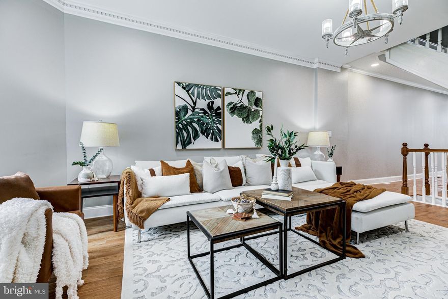 Full gut Renovation with ALL Building Permits.  Fully finished full height basement with french drain, sump pump, basement has  a bedroom,  bathroom, and windows.  2 generous bedrooms upstairs with  2 full baths. Main bath with tub and shower, custom tile work. Wood floor throughout and basement tiles,  NO carpet. Central A/C ,  quartz CT. high-end appliances,  REAR deck and paved parking pad in the rear, brand new roof, and new skylight.  new stucco in the rear wall freshly pointed brick on the side. Please hurry, this will NOT last.