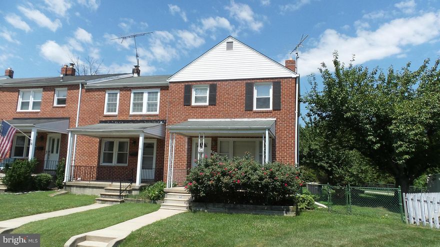 End of group townhome w fenced rear yard coverd front porch & rear patio, 2 prk spaces, shed. Lg open first floor liv/din areas w hardwd fl. Open updated galley kitchen w granite. 2nd fl hardwd fl w lg master br, 2 add'l br, updated bath w linen closet. Lg family rm in LL, Util rm w W &D, storage, rear entr., add. toilet rm. Move-in condn Freshly painted. Floors refinished.