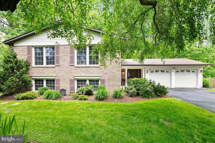 Home is much larger than it appears. This split foyer has a fantastic foyer that leads to the screened-in porch that includes a water feature and backs to woods that are great for bird watching and nature enjoyment. The house features 5 bedrooms and 3 full baths. The kitchen has been expanded for family gatherings and the matching updated cabinets include self-closing doors and pull-out bottom shelves that make cooking more functional. The kitchen is open to an eat-in breakfast nook with heated floors. Both the living and dining rooms have floor-to-ceiling windows that overlook a wooded lot. The wooded lot is home to wildlife, including deer and squirrels, which provides plenty of bird watching opportunities. The upper level offers 3 bedrooms and 2 full bathrooms. The primary bathroom has been updated, and all 3 rooms are large and have solid hardwood floors and ceiling fans. The hall bath is updated as well. The lower level offers 2 bedrooms and a full bathroom. The family room has new hardwood floors and a cozy fireplace. There's enough space to entertain upstairs, downstairs, outside, or on the screened-in porch. The house has a backup generator along with gutter guards. The home sits on a cul-de-sac, and Longwood Knolls has extensive sidewalks and trails to enjoy.