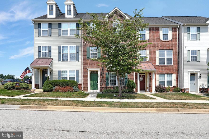 Sparkling clean, freshly painted, and move-in ready! This brick-front townhome has a hard-to-find feature: an entry-level bedroom and full bathroom! There is also a kitchenette on the entry level.  On the main level, you'll find the kitchen, with gas stove and island. A family room with a fireplace, dining room, living room with bay window, and half bath complete this level. Upstairs, the primary suite features a giant walk-in closet and bath with soaking tub and shower,  plus two other bedrooms and another full bath.  In the backyard, there is a recently re-stained deck with concrete patio below. You'll have your own paved driveway in the back.  Best of all, this townhome is located directly across from the tennis courts and playground in the Huntfield neighborhood!