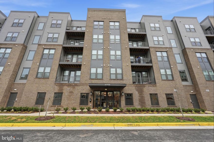 Welcome to this beautiful 2-bedroom, 2-bath luxury condo located on the top floor in the sought-after Residences at Waxpool Crossing in Ashburn. Built in 2024, this modern home features an open-concept floor plan with approximately 1,300+ square feet of stylish living space. 

The gourmet kitchen includes stainless steel appliances, upgraded countertops, and a large island that flows seamlessly into the dining and living areas—perfect for entertaining. Enjoy luxury vinyl plank flooring in the main living spaces, cozy carpeted bedrooms, and a spacious primary suite with a walk-in closet and spa-like bath. Step outside to your private balcony for fresh air and relaxation. 

Working from home? You will love the home office space right by the entryway. Additional highlights include in-unit washer and dryer, elevator access, and a reserved garage parking space with extra parking on the street. Residents enjoy fantastic community amenities including a lounge, community room, dog park and grooming spa, gym facility, and outdoor pavilion with grills and fire pit. 

Conveniently located near major commuter routes, the Silver Line Metro, shopping, dining, and Dulles Airport. Available now!