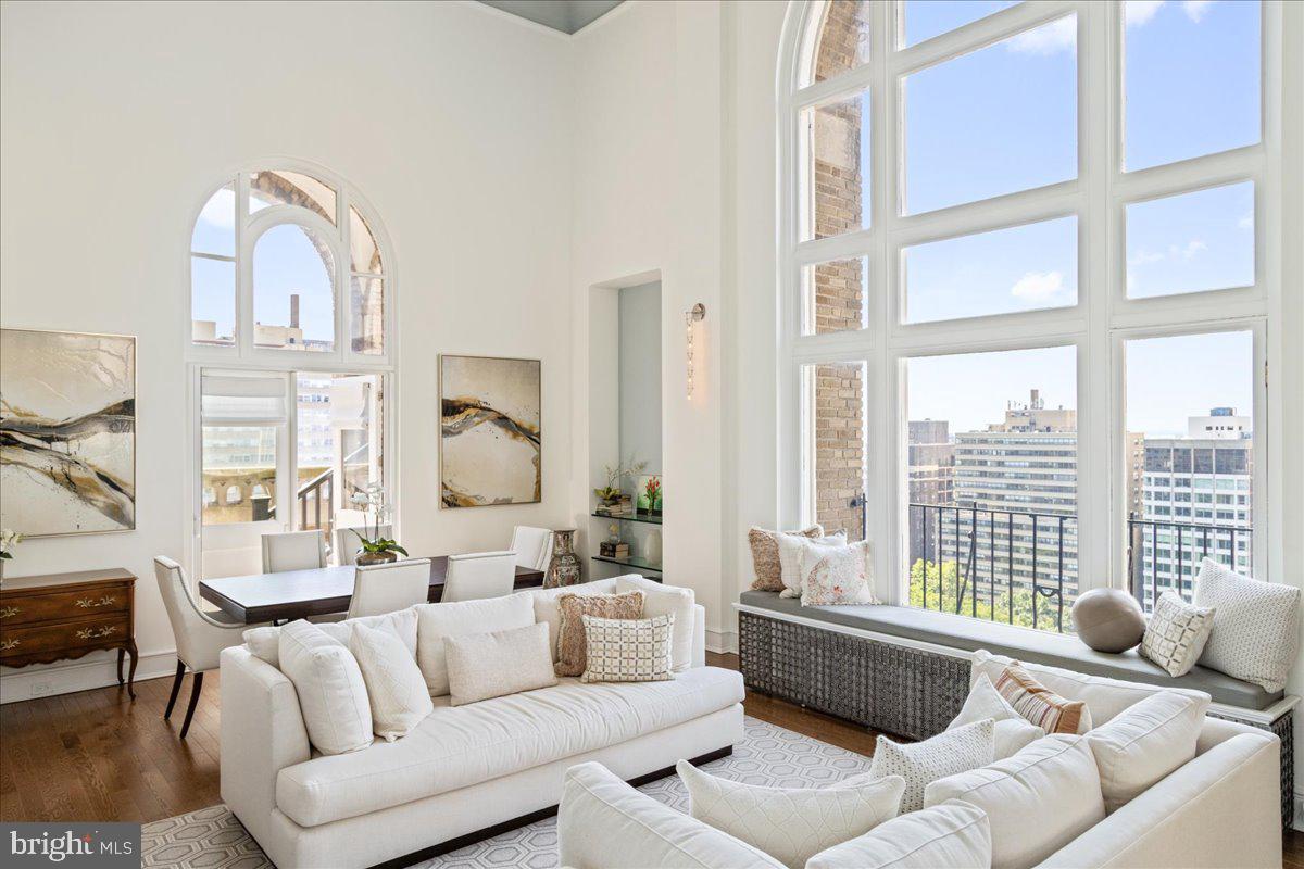 Overlooking Rittenhouse Square, this one-of-a kind, bi-level, 3420 sq ft Penthouse has been fully renovated, with 4 bedrooms and 4.5 bathrooms. This home is completely reimagined by award-winning architects, Kass & Associates, Spogue Kitchens and Baths, and construction by Weaver Luxury Living. The grand living room boasts an 18-foot beamed ceiling and a majestic arched window overlooking the park. A focal point for the room is the original architectural fireplace with marble surround. Double arched doors on each side of the living room open onto charming balconies with spectacular views of the park and beyond. A large archway from the living room leads to an elegant Chef's kitchen with Wolf, Subzero and Cove appliances, custom cabinets made by Artcraft, leathered granite countertops and backsplash. An oversized island anchors the space, providing ample room for meal preparation and casual dining. The spacious kitchen features an additional sitting area, also perfect for a dining table. The primary suite conveniently located on the first floor includes a spa-like ensuite bath with floor-to-ceiling marble, a soaking tub and a step-in shower. Adjoining the bath is a large walk-in closet with custom cabinets and a well-appointed laundry area with an entire wall of built in cabinetry. Completing the first floor is a marble powder room. On the second level, there are three generous sized bedrooms, each with an ensuite floor-to-ceiling marble bathroom and walk-in closet. This level also includes a second laundry and an overlook of the great room with stunning views through the signature window. 19D & 20D represents the height of luxury and modern living, with solid oak floors, fire sprinklers throughout, multi-zoned HVAC, and AcoustiBlok soundproofing. A ground floor deeded parking space is available for purchase at 2020 Walnut Street. The Rittenhouse Plaza is a pre-war building, overlooking Rittenhouse Square where one is amid the latest trending restaurants, casual eateries, upscale shopping, museums, and so much more. Residents enjoy a 24-hour concierge, a lush courtyard garden, and all of the fabulous perks and conveniences of its Rittenhouse Square location. The building is maintained beautifully, and the staff is very professional and on hand. It’s an ideal place to call home! The monthly co-op fee includes real estate taxes, Fios cable, internet, heat, water, sewer, and building maintenance.