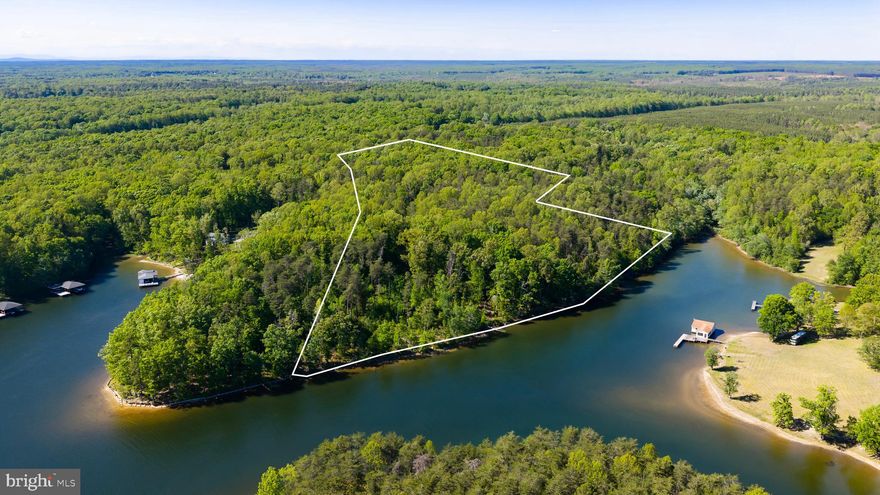Exceedingly rare waterfront opportunity at Lake Anna:  premium 19+ acre waterfront lot with over 1,000 feet of pristine undeveloped shoreline along the most coveted portion of Lake Anna's public side.   Non-HOA.  Dream location: wide, deep, and clear water, short boat ride to El Gran Patron waterfront restaurant, Pleasants Landing, dike 3, and the dam (deepest and most-coveted part of the public side).  Builders / developers: subdivide and sell numerous stunning waterfront lots.  Individual buyers: build a massive family compound and enjoy complete privacy.  Or build on half of this lot, and sell the other half for a big return.   Premium waterfront lots at Lake Anna sell now for top dollar because such lots are rare and in high demand.   For example, recently other waterfront lots at Lake Anna with only 2 acres and far less shoreline have sold for more than $700,000.   INVESTORS: short term rentals are permitted at this non-HOA location; subdivide and build multiple AirBNB homes, sit back, and watch them print money.  Incredible blank-slate opportunity for developers, builders, or an individual buyer.