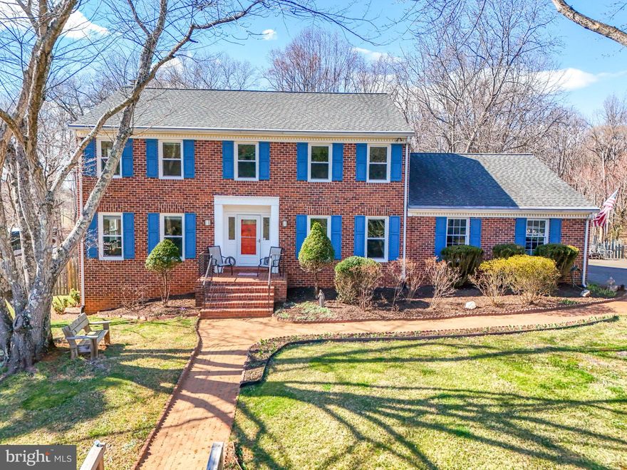 Welcome to this beautifully maintained five-bedroom, four-bath brick-front colonial, ideally situated on a quiet cul-de-sac in one of Warrenton’s most desirable neighborhoods—with no HOA. Set on a spacious 1.1-acre lot, this home offers privacy, outdoor living, and a serene setting, featuring a large deck that overlooks a gorgeous in-ground pool. Inside, the home features a spacious kitchen that opens to a generous family room with direct access to the rear deck, creating an ideal space for gatherings and everyday living. Adjacent to the kitchen is a formal dining room, and a large living room with French doors that lead into the family room. The main level also includes a fifth bedroom, which can serve as a perfect home office, guest room, or den for those working remotely. Upstairs, the primary suite provides ample space for a sitting area, along with an ensuite bathroom and walk-in closet. Three additional bedrooms and a full hallway bathroom with a double vanity complete the upper level, offering plenty of room for family or guests. The fully finished walk-out basement includes a full bathroom and a private entrance, making it ideal for an in-law suite, au pair quarters, or entertainment space. The basement also features a nicely sized room for storage, keeping your living areas clutter-free. Recent updates include fresh paint throughout the upper two levels and new luxury vinyl plank flooring in the basement in 2025. A new upper-level HVAC system was installed in 2024, along with a lower-level HVAC system in 2022. The water heater and filtration system were replaced in 2020. Conveniently located on the DC side of Warrenton, this home offers easy access to shopping, dining, and commuter routes to the rest of Northern Virginia. With its exceptional layout, location, and amenities, this property is a rare opportunity not to be missed.