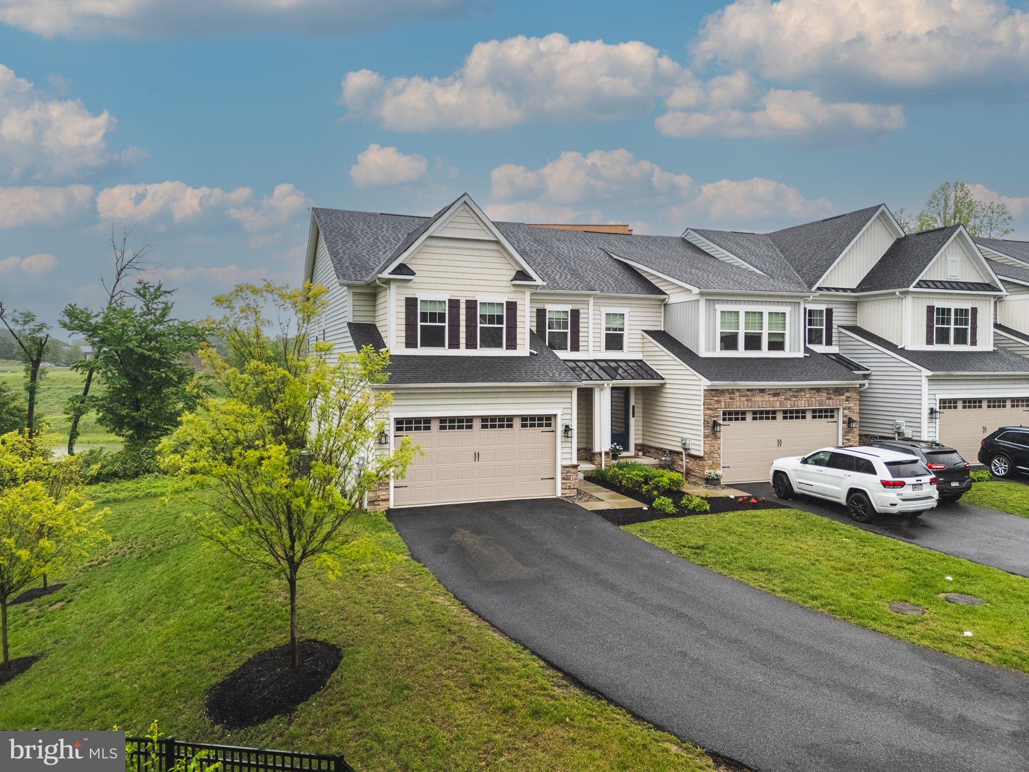 Discover this stunning 4-bedroom, 3.5-bath Northshire Model in the premier Ponds Edge community. Situated on a private lot backing to woods, this home offers over 3,000 sq ft of stylish living space with a fully finished walkout basement.
The open main level features hardwood floors, a spacious great room, and dining area with French doors leading to a private deck. The gourmet kitchen includes a quartz island, stainless steel appliances, pantry, and custom mudroom built-ins.
Upstairs you'll find four generously sized bedrooms, including a luxurious primary suite with dual walk-in closets and an en-suite bath. A second-floor laundry room adds everyday convenience.
The finished walkout basement with a full bath offers flexible space for a guest suite, office, or rec room. Community amenities include a clubhouse, gym, and playground.
Located minutes from Media, SEPTA rail, major roadways, shopping, and dining—all within the award-winning Rose Tree Media School District.