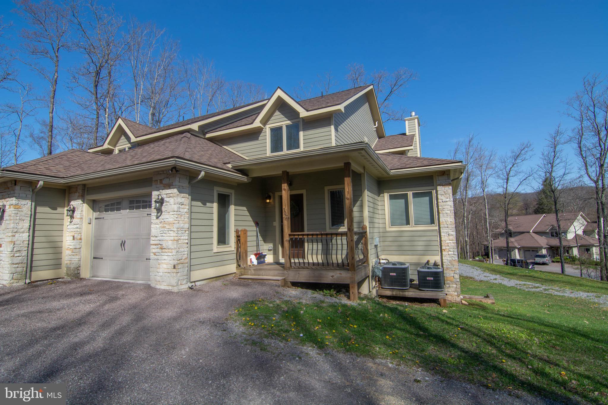 Gather Inn! Newer constructed 5 bedroom townhome in Timberlake Village with unobstructed lake views of Deep Creek! Impressive features throughout including granite counters, stainless appliances, 3 master suites, hot tub, 3 finished levels, and 1 car garage. Impressive rental history. A more private, highly desirable location at the top of the community.