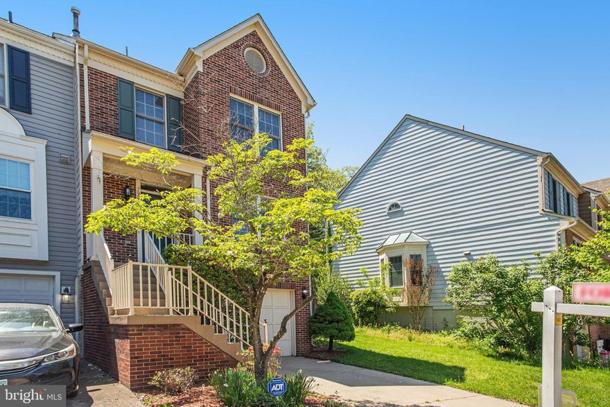 Don’t miss this brick end-unit townhome featuring a rare sunroom addition and attached garage in a serene, tree-lined Manassas community! Step into a light-filled country kitchen with ample space for entertaining and casual dining. The upper level boasts dual master suites, each offering comfort, privacy, and generous closet space. The 4th-level loft is perfect for a home office, reading nook, or creative space. Retreat to the owner’s suite featuring a spa-like bathroom with a whirlpool soaking tub, separate shower, and double vanity. The walk-out lower level includes a third bedroom suite or rec room with a cozy corner fireplace, large storage closet, and full bath—ideal for guests or in-law potential. Enjoy quiet evenings or morning coffee on the rear deck overlooking trees and open common area—a peaceful escape just minutes from shopping, dining, and major commuter routes.