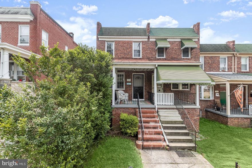 A beautiful 2 bedroom, 1 bath semi-detached, porch-front rowhome awaits in the charming and delightful neighborhood of Hampden! An abundance of dining, shopping, and entertaining are moments away on the Avenue, The Rotunda, Clipper Mill, Woodberry, Roland Park, and even walk to the Miracle on 34th Street! Arrive at the main level by way of the spacious front porch, perfect for tranquil moments enjoying morning coffee, tea, and evening cocktails, or the rear parking pad and fenced yard for easy parking and convenience. The living room welcomes you home and features hardwood floors that continue throughout, and guides you into the gourmet kitchen boasting space for a table and/or island, modern appliances, a decorative backsplash, and tasteful 42” cabinetry. Relax and unwind in either of the two sizable upper-level bedrooms and a renovated bath with subway tile, modern vanity, and open shelving. The lower level provides many possibilities as an office, family room, or workshop with laundry, storage, and access to the landscaped grounds. Major commuter routes include the MARC train, bus lines, Falls Road, I-83, Cold Spring Lane, Charles Street, and 41st Street. Don’t miss this amazing opportunity to own in sought-after Hampden; schedule an appointment today!