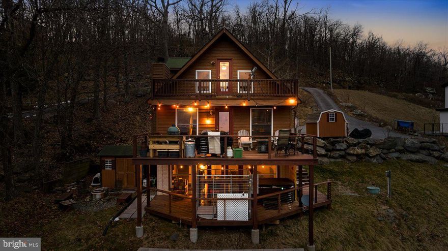 This home has the WOW factor you've been looking for!  The sunsets are spectacular and can be enjoyed from just about every room in the house.  All three levels of this home have unique decks which provide ample opportunities for relaxation.  The cozy deck off the primary bedroom is the perfect spot for a quiet evening.  Entertain on the large deck easily accessed from the great room after preparing a wonderful meal in the newly renovated kitchen complete with an induction stove and convection oven. The lower level family room provides additional space to spread out and opens to the bottom deck which is equipped with a hot tub and outdoor bar.  All of this is located in the gated community of High Knob which offers a range of amenities for residents to enjoy including a community pool, tennis, and pickleball courts, walking trails, and its own access to the famous Appalachian Trail. Residents of High Knob can also enjoy the many community events at the clubhouse such as Chili Cook-offs, Line Dancing, and Wine Tasting. In addition to all of this, High Knob has its own regulated public water system so there is no need for individual wells, and for peace of mind, High Knob has its own snow removal crew. Whether you are looking for the perfect vacation home or if you want to live out your best life, this home is one you will want to put on your must-see list!