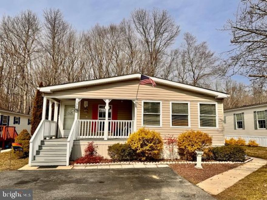 Affordable move in ready opportunity! Beautifully maintained 2-bedroom, 2 full bath manufactured rancher ("Chesapeake" model) located in the desirable 55+ community of Cecil Woods with close proximity to Rt 40, I-95 and shops and restaurants of the quaint and historical water-oriented town of North East, Maryland. As you enter you will be greeted with an open and airy floor plan, crown molding and vaulted ceilings throughout, as well as recently added laminate flooring (2020) in the living room and sitting area/formal dining. The spacious eat-in kitchen features propane cooking, island, pantry, newer dishwasher, skylight and tons of beautiful cabinetry and prep space. Additional main level highlights include a primary bedroom with an attached bath and 2 walk-in closets, second bedroom, laundry and second full bath. Exterior details include 2 storage sheds, a covered front porch, attractive landscaping, in addition to an enclosed porch (ideal for hobbies or additional storage). The active community center offers a large clubhouse with features that include a spacious gathering area with a kitchen, exercise room, library, party room, billiards, picnic area with a pavilion and walking/jogging paths. Ground rent is $608.00 monthly (no property taxes!) and includes trash pick-up, sewer and snow removal on the streets. Buyer must receive park approval from Cecil Woods (see attached documents for application). If you are searching for a well-kept home in a peaceful, friendly and walkable community, your search is over...130 Woods Way...Welcome Home!!!