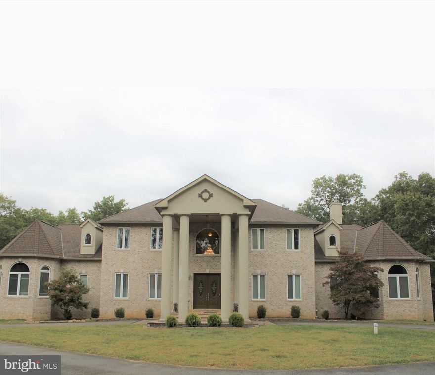 This is a MUST SEE estate home!  Sitting on 4 1/2 acres of land nestled in a cul de sac.  This home boasts 7 bedrooms and 7 1/2 bathrooms.  2 Story foyer, spacious living room and dining room enhanced by 2 beautiful chandeliers.  Nice, step down 2 story great room with fireplace.  The heart of the home embodies a large stately kitchen with connected morning room, which allows access to the deck.  Main floor offers a huge primary suite with large his/hers closets, fire place, and spa on-suite that includes 2 person shower and jacuzzi tub with jets.  There is also a junior suite on the first floor that can be used as an in law suite.  Upper level boasts 3 bedrooms, with full bathrooms in each!  Lower level includes a huge basement equipped with 2 bedrooms, exercise room, movie theatre, family room, custom bar and much more!!  Don't take my word for it, come see for yourself.  You will not be disappointed!!!