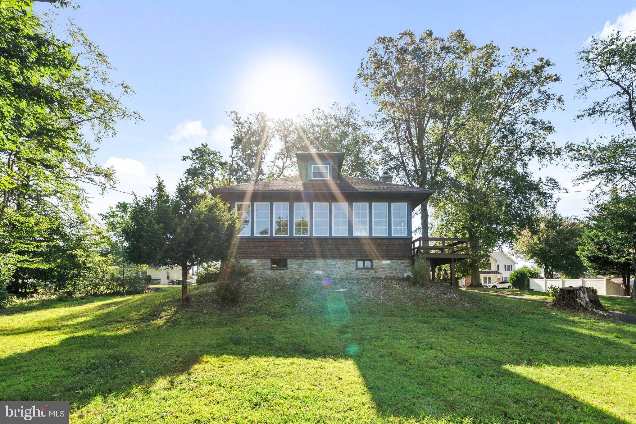 Welcome to 1060 Old Lincoln Highway. Step into timeless charm with this circa 1922 Cape Cod Craftsman style home, blending original character with thoughtful modern updates. The first floor showcases a remodeled kitchen with ceramic tile backsplash and propane stove ,opening to a spacious formal dining and living room combination highlighted by a decorative stone fireplace and gleaming hardwood floors and elegant curved walls and striking beamed ceilings. The lower level is completed with rich plank flooring throughout. An enclosed heated front porch offers the perfect spot to relax and take in your surroundings. Upstairs you'll find an open office space ,three comfortable bedrooms and a continuation of the homes warm character . Stained glass accents and rich original woodwork have been lovingly preserved throughout, adding to the homes authentic appeal. The spacious layout includes a full basement and a rear deck that is perfect for entertaining family and friends, Thoughtful details such as built in chairs and custom cabinetry add both style and functionality, making this property, truly a one of a kind. Set on a private oversized lot with country like feel, this property offers a rare combination of historic craftsmanship, modern updates, and peaceful living.
