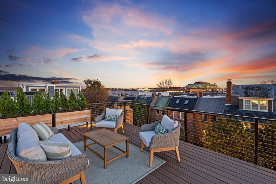 Ring in 2025 with this newly renovated elevator end townhome with Capitol and Potomac River views.  Just steps to the Potomac River, Founders Park and the hussel and bussel of Old Town. Thoughtfully designed with 4 bedrooms, 4.5 baths, and 4 inviting outdoor spaces, a rarity in the city.  

Step into the main living area, where 11-foot coffered ceilings create an airy, elegant atmosphere, and 12-foot glass sliding doors lead to a private stone patio—ideal for relaxing or entertaining. The chef’s kitchen, with its large center island and space for a generous dining table, is the perfect setting for everything from casual meals to lively gatherings, all while enjoying peaceful river views.

The crown jewel of the home is the 528 sq. ft. rooftop terrace, where breathtaking views of the Capitol, Washington DC and National Harbor make every moment unforgettable. Each bedroom is a private retreat with its own ensuite bath, and two feature their own private outdoor decks.

Beautiful wide-plank white oak floors, custom millwork, and thoughtful finishes are found throughout, offering a timeless aesthetic. Completing the home are a one-car garage and an additional off-street parking space plus more garage spaces available just steps away.

Perfectly positioned in Old Town Alexandria, this home pairs everyday luxury with the charm and accessibility of one of the area’s most sought-after neighborhoods. A private fenced back yard for entertaining and no HOA. A perfect lock and leave home for those with busy travel schedules.