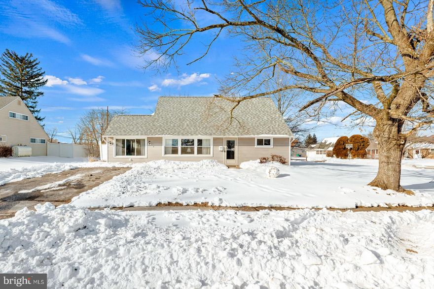 Welcome to this beautifully updated 4 bedroom, 2 full bathroom Cape Cod situated on a desirable corner lot in the Levittown section of Bristol Township. This move in ready home offers a flexible layout, modern updates, and excellent exterior space along with ample parking. Step inside to a bright and welcoming main level featuring updated flooring, neutral tones, and a comfortable flow between the living and dining areas. The renovated kitchen is a true highlight, showcasing stylish two tone shaker cabinetry with crisp white upper cabinets and gray lower cabinets, granite countertops, stainless steel appliances, and modern finishes that create a clean, contemporary feel. The home features two bedrooms and a full bathroom on the main level, along with two additional bedrooms and a second full bathroom upstairs, providing versatility for guests, a home office, or multi generational living. The former garage has been thoughtfully converted into additional finished living space, creating a spacious bonus room ideal for a family room, playroom, gym, or extended entertaining area. Situated on a corner lot, the property offers a front yard, side yard, and rear yard, giving you multiple options for outdoor enjoyment. A long asphalt driveway provides ample off street parking for multiple vehicles, making it ideal for households with several drivers or frequent guests. Conveniently located near major highways, shopping, dining, and local parks, this updated Cape Cod combines space, functionality, and location in one complete package. Move right in and make it yours.