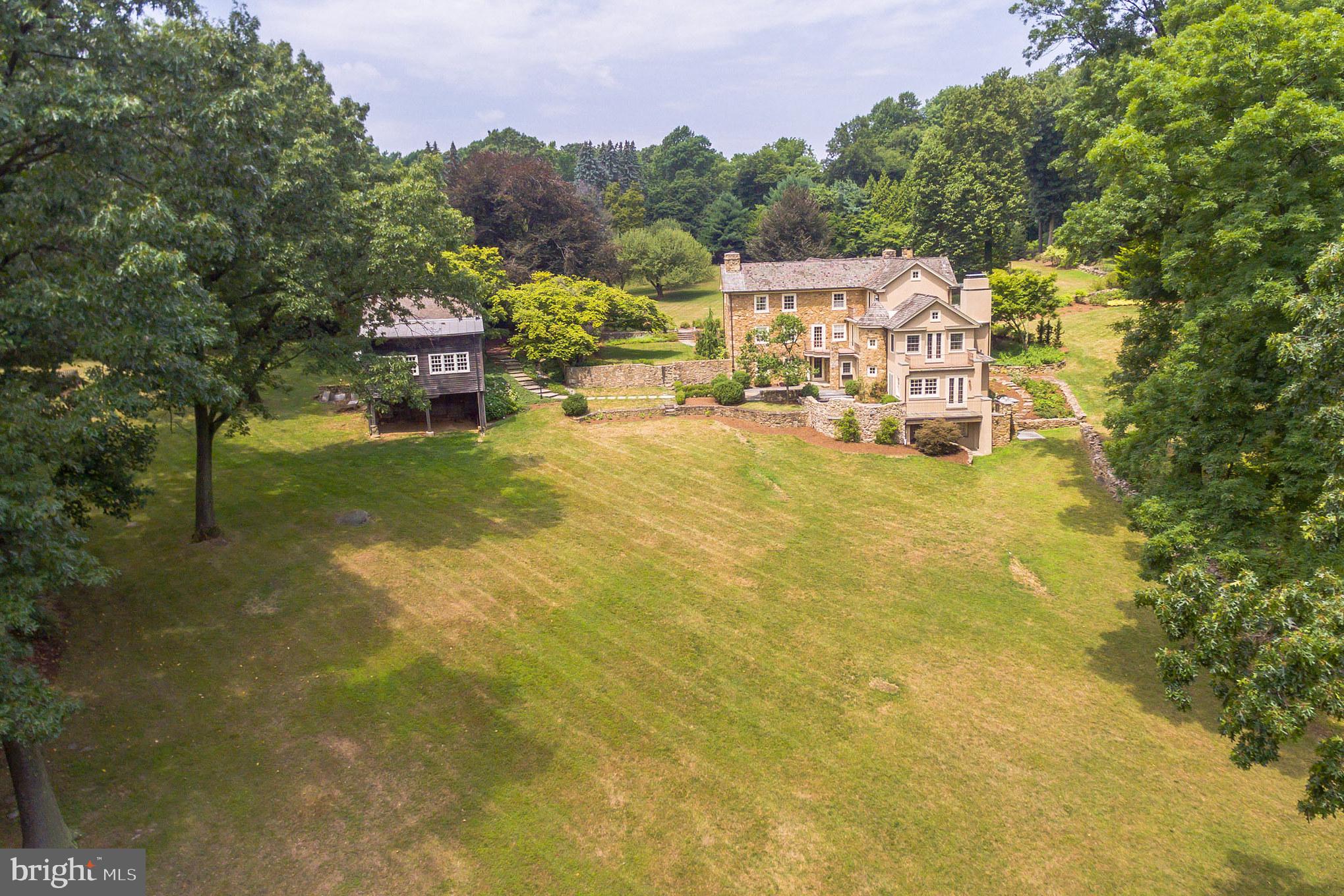 If you're looking for a spectacular one-of-a-kind home encompassing 6700 sq.ft of living space, set amongst pristine landscaping & privacy then welcome to 2537 Flowing Springs Road! The original fieldstone house was built in 1769 and the home has been lovingly renovated and restored over the centuries by caring owners including the one time curator of Winterthur, the Dupont estate, in the 1940's. The most recent addition in 2000 designed by Helena van Vliet was intentionally designed to create spaces of rest and refuge with charming balconies, overlooks, patios and window seats throughout.The refreshing in-ground pool was completely renovated in 2010 with the addition of stone around the spa & waterfall. This property also includes a barn/office/studio space; 2 stalls are located below the separate bright office and large studio/party barn space. This home is not to be missed! A lovingly maintained estate in the heart of Birchrunville!