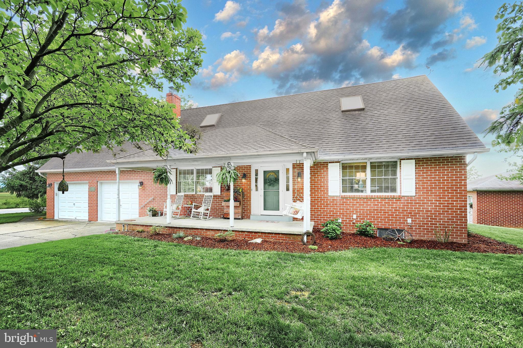 Custom -built all-brick Cape Cod in Conewago Valley School District with 4 bedrooms, 2 full baths and quality craftsmanship this house has a flexible and function floorplan. First floor includes a bedroom, living room, office/den, full bathroom, laundry room, and a spacious modern kitchen with granite countertops and pantry. Enjoy a bright brick sunroom off the kitchen/dining area. Second floor bedrooms are spacious and bright with plenty of closets. Home also offers central A/C, a two-car attached garage with storage area, and a 1 car detached brick garage for workshop or hobbies. Large paver patio for relaxing & enjoying the rural setting. A perfect blend of charm, space and functionality. Don't miss your chance to own this well cared for quality-crafted home with room to grow.