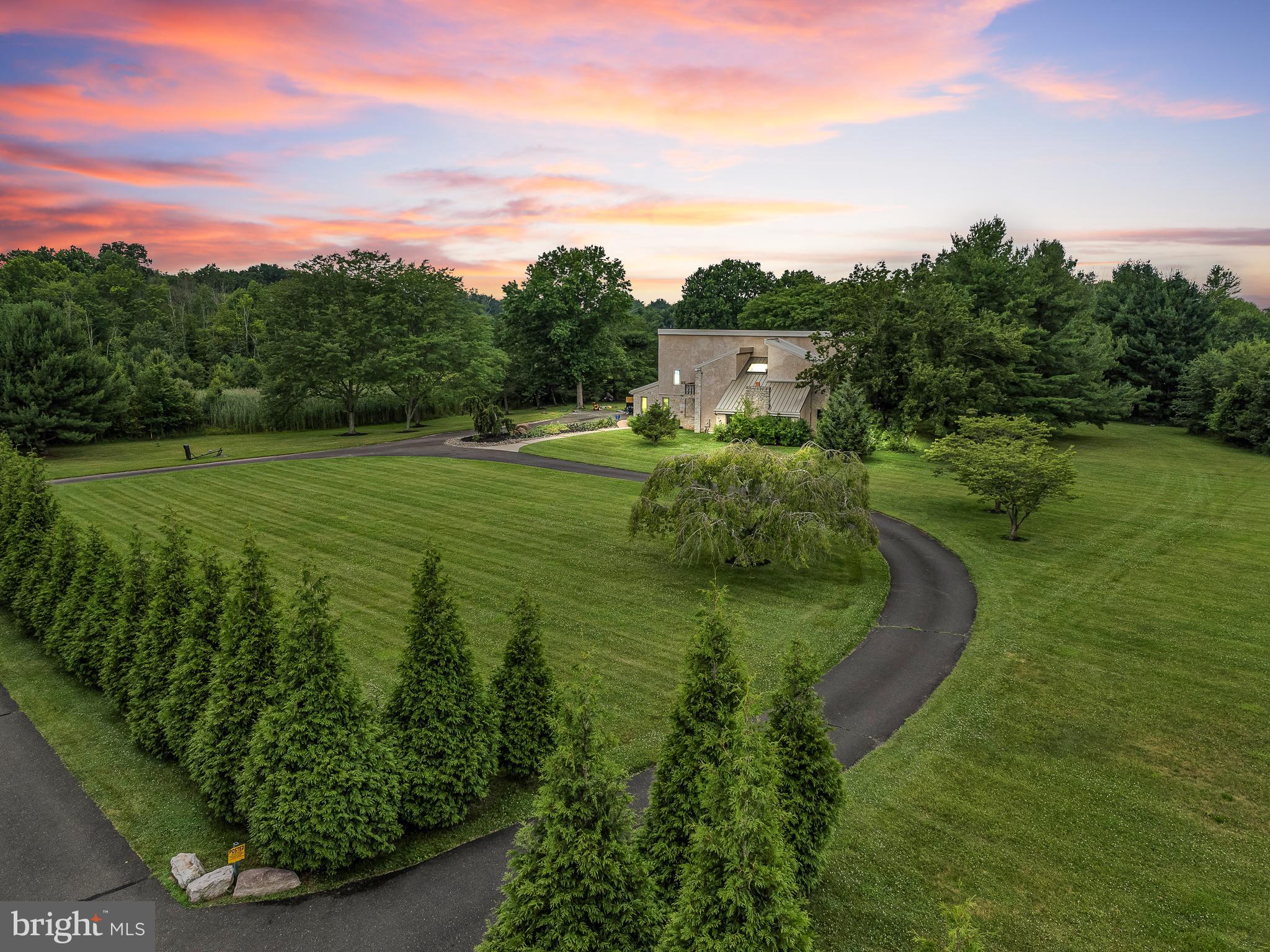 10 acres! Welcome to a remarkable opportunity to own your slice of paradise! Nestled on a private cul-de-sac road within the heart of historic Bucks County and prestigious Council Rock School District, we present to you an exceptional, low property tax, tract of residential land spanning an impressive 10 acres.
The home is equipped with modern touches both inside and out. The exterior of the home was completely renovated including a premium standing seam metal roof, as well as a custom concrete pool with electronic retractable summer cover. Inside, three separate floors of living space check the boxes for any and all needs. From the private ground floor in-law/au pair living quarters, to the oversized master bedroom suite, the home features five bedrooms in total. Each of the home’s four bathrooms highlight a modern taste. The spacious kitchen with stainless steel appliances provides perfect flexibility for not only family meals, but also hosting large gatherings. The vast finished basement is a blank canvas waiting to become your special hideaway.
Immerse yourself in the wonders of nature as you explore your very own private oasis across all 10 acres! Develop walking or riding trails, create picturesque picnic spots, or even set up a farm with gardens and orchards. Embrace the joys of outdoor living and savor the beauty of nature right outside your doorstep, without having to sacrifice any of the local amenities and access to Philadelphia, New York and New Jersey. This is truly a rare opportunity to own a one-of-a-kind property.