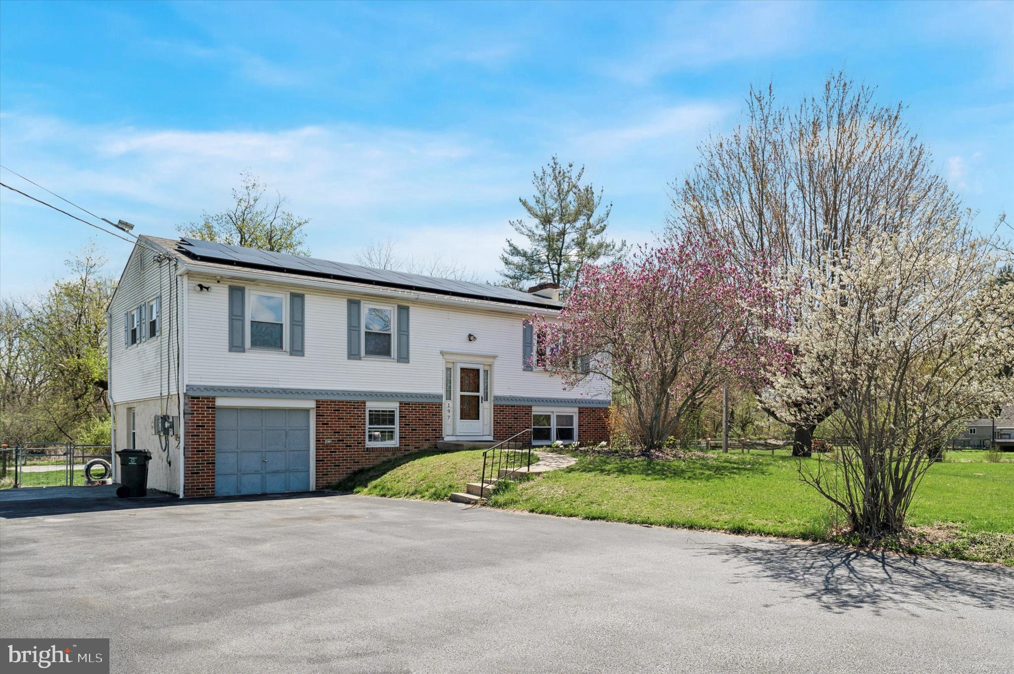 Welcome to 197 Loomis Ave! Nestled on 0.67-acre lot, this charming bi-level home offers a perfect blend of style, comfort, and functionality. Upon entering the home, a small foyer greets you, offering access to both the upper and lower levels. As you enter the upper level you are greeted with a warm and inviting living room. The focal point of this room is a stunning bow window that exudes charm and character bringing in natural light. The open floor plan greets you with a sense of spaciousness and continuity. The living room, dining area, and kitchen flow effortlessly into each other. At the heart of the kitchen is a stunning center island. This island serves as a multifunctional centerpiece, perfect for meal prep, casual dining, or simply enjoying a cup of coffee. Surrounding the kitchen are 42-inch cabinets, which extend to the ceiling, providing ample storage for all your cooking essentials. A charming bay window adds natural light to the kitchen. The upper level includes three comfortable bedrooms with the master bedroom including a spacious walk-in closet. This level is complete with a full bathroom. Enter into the lower level of this home where you will find a cozy family room, complete with a charming wood stove. The lower level also includes the 4th bedroom and a full bathroom. Pass through the sliding glass doors into the backyard where you're greeted by a swimming pool. This inviting oasis is perfect for relaxation and recreation, offering a cool escape during hot summer days. You don’t want to miss out on this home! Schedule your showing today!