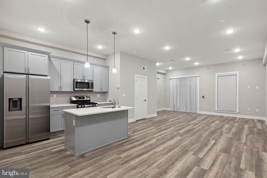 Discover modern urban living at its finest in this newly constructed quadruplex located at 2401 N Mascher St in the vibrant West Kensington neighborhood of Philadelphia. Each of the four units in this quadruplex is bi-level, offering a unique living experience. One unit features 2 bedrooms and 2 bathrooms, while the remaining three units showcase 2 bedrooms and 2 and 1/2 baths. The cleverly placed half bath on the main floor adds convenience to your daily routine. The open-concept living and kitchen spaces are designed to maximize comfort and flexibility. Stainless steel appliances, a kitchen island with quartz countertops, and ample cabinet space make these units a dream for both aspiring chefs and casual cooks alike. Each unit also has an in unit washer and dryer. Seize the opportunity to benefit from the remaining years on the tax abatement, a valuable feature that translates to significant savings. With the York-Dauphin Station for the Market Frankford Line just blocks away, commuting to Center City becomes a breeze. Plus, indulge in the culinary delights of Philadelphia with an array of fantastic restaurants just around the corner. Whether you're a homeowner looking to alleviate mortgage costs or an investor seeking a low-maintenance asset for your portfolio, this quadruplex presents an enticing opportunity. Embrace the urban lifestyle, capitalize on convenience, and make this modern gem your home or investment haven. Welcome to a new era of sophisticated living in West Kensington!