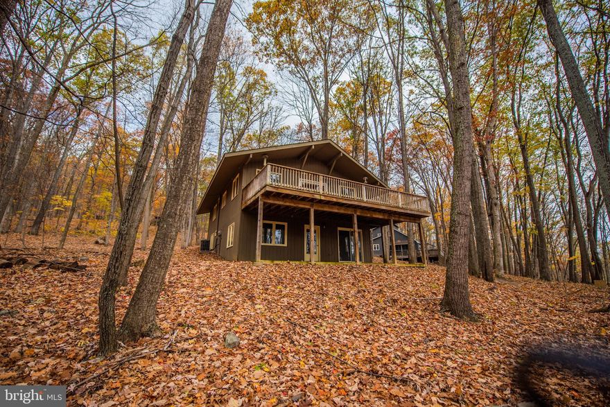 Cabin in the Woods,  This well maintained retreat has 5 bedrooms and 4 baths, Great room with wood burning stove, Family room, and Laundry closet, making it ideal for the whole family enjoy or vacation rental.  Many windows adorn this cabin on both floors giving an open and peaceful view of the nature that surrounds it.  The community of Coolfont has a swimming pool and spa, as well as hiking trails and an activity barn. The Coolfont Resort will be reopening soon with restaurant and spa for added value. Most furnishings convey.  Make your appointment today!