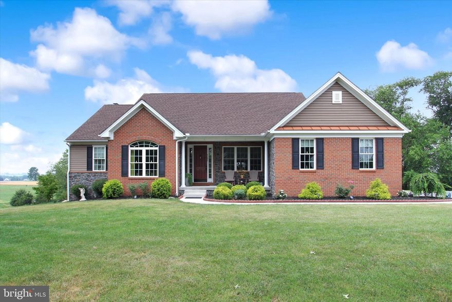 An impressive custom-built three-bedroom rancher in Paradise Township with surrounding scenic vistas!!  Looking to create your own private equestrian facility? Look no further...this stunning farm/home greets you with a large covered front porch and decorative mature foliage. Entering into the foyer you will notice the overall architectural design is exquisite with unique columns, tray ceilings, wainscoting,  crown molding, gleaming wood floors as well as french doors. The upgraded kitchen boasts granite countertops, custom ceramic backsplash, stainless appliances, soft-close cabinetry, a pantry, plenty of workspace, a charming breakfast nook surrounded by windows, and tons of sunshine. The adjoining living room comes complete with vaulted ceilings as well as a cozy corner stone fireplace that is adorned with a wood mantle. Off of the kitchen, you will find a wing that houses two large bedrooms, both with floor-to-ceiling closets, a bathroom with double sinks as well as a custom-built mud room and first-floor laundry. The Primary Suite, with an enclosed full bath/whirlpool tub, is nestled in a private nook off of the living room. There is also a beautiful dining room and a stately office that will make entertaining guests or clients a breeze! If you need additional living space this property has a substantial basement with a completed, decorative full bath and pellet stove insert that is just waiting for your final touches! This level offers a walk-out to the shaded patio located at the rear of the home. Situated on 30+ acres, this property can accommodate both your horse's and your family's needs. It also comes complete with a covered raised deck, a huge pole barn (96' x 48'), a 2-car attached garage, a 4-car detached garage as well as plenty of additional parking space located by the extensive pole barn. This barn offers 2 oversized garage doors for possible farm equipment and 2 camper- sized doors for RVs or trailers.  Plenty of land just waiting to house an outdoor ring and indoor arena!! The solar panels are PAID in FULL and propane tanks are owned. This property is surrounded by rolling farmland and genuinely breathtaking views. Property sells with adjacent land parcel of 6.48 acres. This lot has electric run to the home site, it's own well, septic approval for 3 bedroom home, and a paved driveway!! Don't miss your opportunity to see this for yourself!! Schedule your showing.......