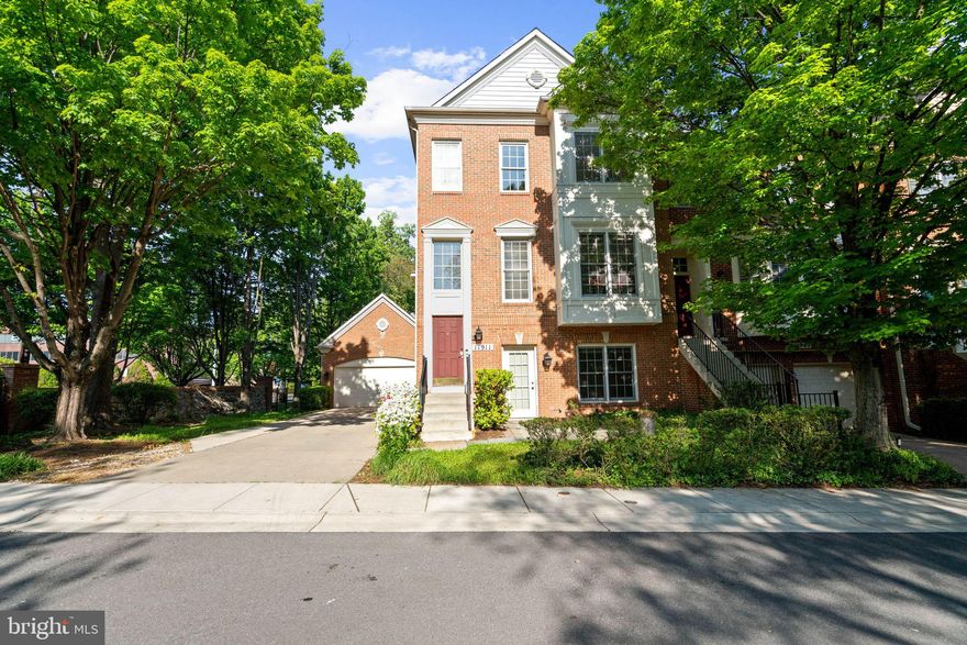 Brimming with convenience in a quiet location, this luxurious end-unit townhouse offers 3,400+/- square feet across four levels of living. Featuring bright, sun-filled spaces with gorgeous custom moldings, oversized windows, hardwood flooring, and two gas fireplaces. An entry-level bedroom with an en suite full bath and a walk-in closet creates a primary bedroom alternative or a flex space for guests. The floorplan also provides  outdoor access directly from the lower level recreation room and access to the converted two-car garage, currently configured as a conditioned flex space. The main living level boasts an outstanding table-space kitchen with a beautiful breakfast bar and access to a rear deck perfect for indoor and outdoor gatherings. The delightful kitchen overlooks the sunny family room anchored by a gas fireplace. The open floor plan flows into the gracious dining / living room, and there is a powder room tucked away for the utmost convenience.
The upper level is highlighted by the spacious primary bedroom with custom tray ceilings, a cozy gas fireplace, a spa-like en suite bathroom with dual sinks, and a walk-in closet. An additional bedroom, also with an en suite full bath, and purposeful upstairs laundry complete this floor. The private fourth bedroom encompasses the top floor and enjoys a sizable walk-in closet and an en suite full bath.
Additional offerings include both front and backyards with mature bushes and shrubs, an attached private driveway for parking and play, as well as a storage space off of the converted garage.
11911 Kings Bridge Way #54 delivers easy living just minutes from downtown Bethesda, Rockville, and D.C. Close to the many shops and restaurants at Pike and Rose, downtown Bethesda, Wildwood Shopping Center, and Montgomery Mall. It is also near NIH and Walter Reed National Military Medical Center. Welcome home to this delightful home in a friendly and exceptionally convenient neighborhood.