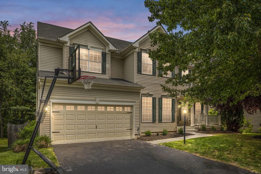 WOW!!  Gorgeous home w/ Dramatic 2story family room w/floor to ceiling brick fireplace.  Awesome front porch to enjoy your morning coffee, fenced lot backing to community woods and Catoctin Creek provide an oasis of privacy.  The oversized deck is perfect for entertaining or just enjoying the peace and quiet. This home has the much coveted Main Floor Bedroom and Full Bath! Gourmet kitchen with gas cooktop, huge island, acres of new granite, double oven, pantry, and cabinets for miles.. Large master bedroom suite with massive walk in closet & spa like master bathroom, dual sinks, soaking tub, separate shower, and skylights that flood the luxury bath with natural light!  Walkout basement ready to make your own. Located in town for easy access to everything that Purcellville and Western Loudoun has to offer.  The neighborhood even backs to WO&D trail.. THIS IS IT!!