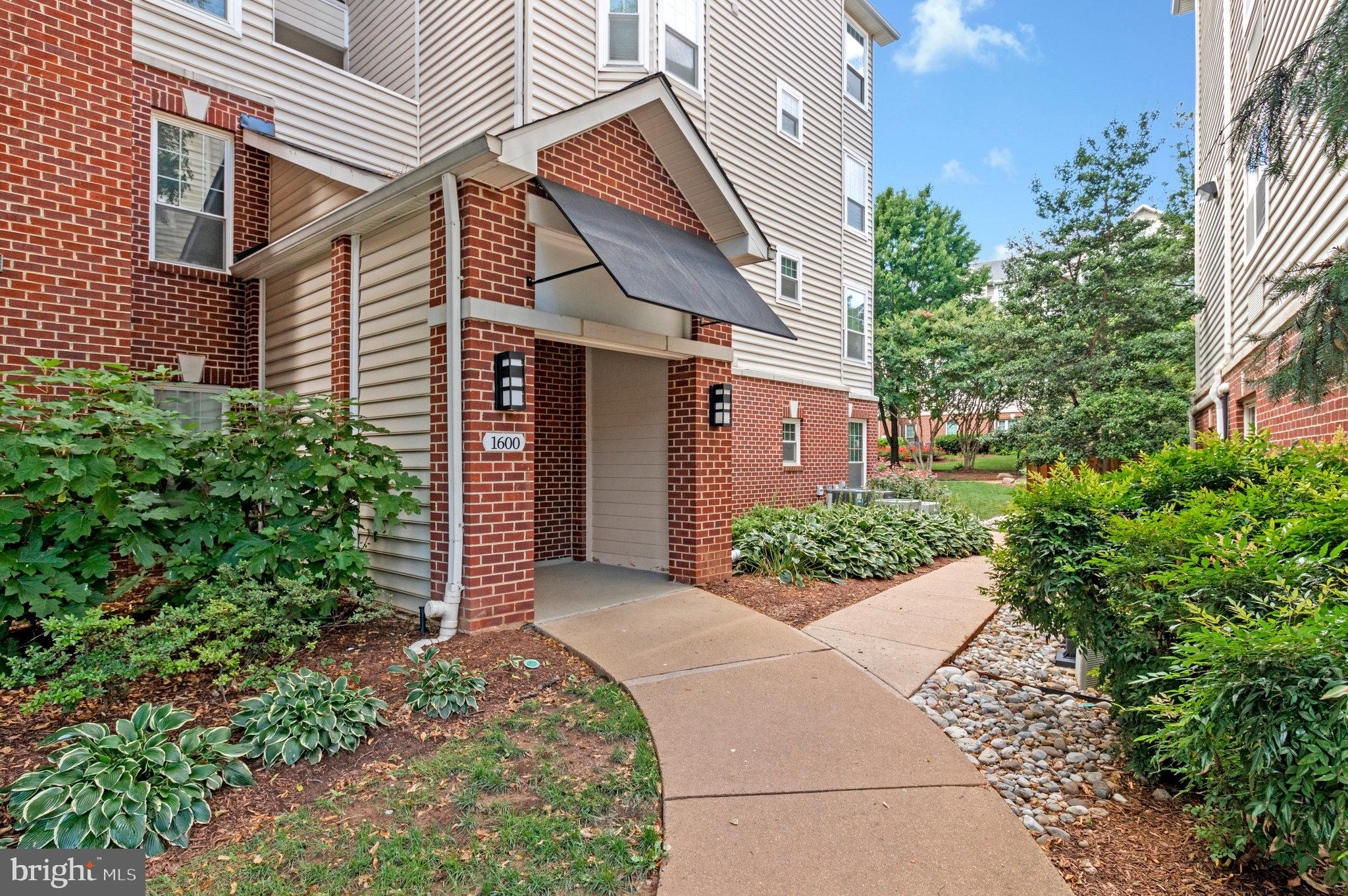 Experience resort-style living in this beautifully maintained and spacious end-unit condo, perfectly positioned on the second floor of the highly sought-after Gates of McLean community. This inviting home features two generously sized bedrooms with elegant laminate hardwood flooring and two full bathrooms, including a private en-suite in the primary suite. The kitchen is equipped with recently installed stainless steel appliances and a cozy eat-in area, ideal for casual dining. An oversized living room extends to a large private balcony—perfect for both relaxing and entertaining. Additional highlights include one assigned parking space and abundant guest parking. Residents of this gated community enjoy a wide array of amenities such as walking trails, a play area, basketball court, BBQ grill area, and a large outdoor pool. The clubhouse offers an exercise room, sauna, showers, and a business center—supporting wellness, productivity, and leisure. Conveniently located near the community center, this condo offers unparalleled access to the Silver Line Metro Station, Wegmans, Tysons Corner Mall, Capital One, MITRE, Rt-123, I-495, and the Dulles Toll Road. Whether you're a professional, a small family, or seeking low-maintenance luxury living, this move-in-ready home delivers comfort, convenience, and an exceptional location. The condo fee includes access to all amenities, water, and trash service.