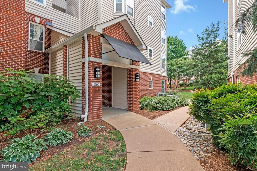 Experience resort-style living in this beautifully maintained and spacious end-unit condo, perfectly positioned on the second floor of the highly sought-after Gates of McLean community. This inviting home features two generously sized bedrooms with elegant laminate hardwood flooring and two full bathrooms, including a private en-suite in the primary suite. The kitchen is equipped with recently installed stainless steel appliances and a cozy eat-in area, ideal for casual dining. An oversized living room extends to a large private balcony—perfect for both relaxing and entertaining. Additional highlights include one assigned parking space and abundant guest parking. Residents of this gated community enjoy a wide array of amenities such as walking trails, a play area, basketball court, BBQ grill area, and a large outdoor pool. The clubhouse offers an exercise room, sauna, showers, and a business center—supporting wellness, productivity, and leisure. Conveniently located near the community center, this condo offers unparalleled access to the Silver Line Metro Station, Wegmans, Tysons Corner Mall, Capital One, MITRE, Rt-123, I-495, and the Dulles Toll Road. Whether you're a professional, a small family, or seeking low-maintenance luxury living, this move-in-ready home delivers comfort, convenience, and an exceptional location. The condo fee includes access to all amenities, water, and trash service.