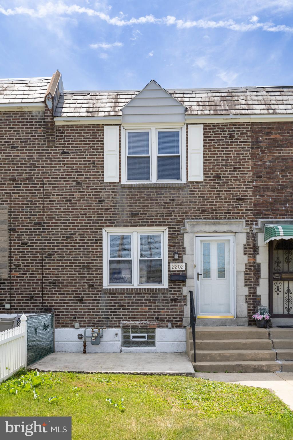 Welcome to this charming townhome, ideal for first-time homebuyers or investors looking to expand their portfolio. This home boasts 3 bedrooms, 2 baths, and a finished basement. The inviting front patio opens into a spacious living room adorned with beautiful hardwood floors that extend throughout the first floor. An elegant arched doorway leads to a bright and airy dining room, seamlessly connected to an updated kitchen with gas cooking and stainless steel appliances. Upstairs, you'll find three sunlit bedrooms with gleaming hardwood floors and ceiling fans, along with a large hallway bathroom. The walk-out lower level offers additional living space, featuring cozy carpeted floors, and a second full bath. Don't miss out on this fantastic opportunity!
