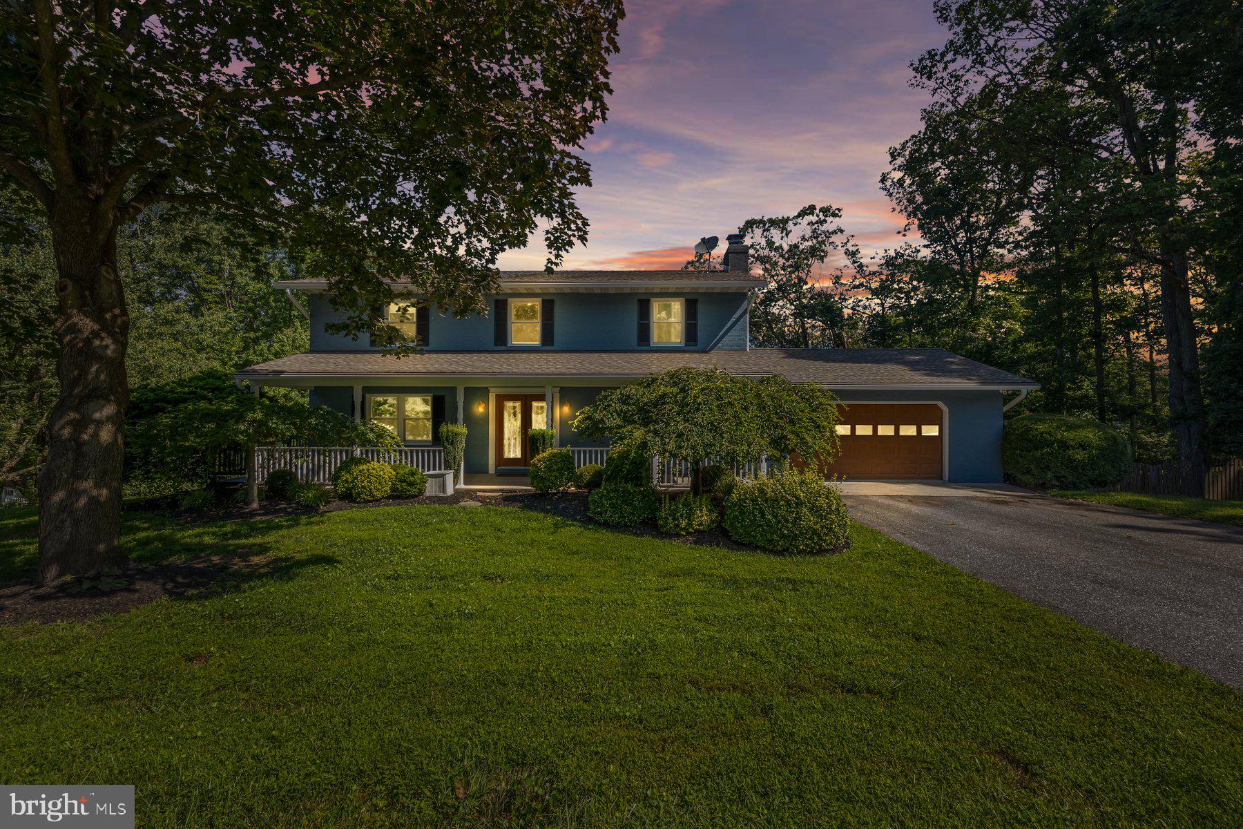 Sprawling 5BR/3.5BA Colonial tucked into the landscape on a beautifully maintained lot in the quiet neighborhood of Arthur Ridge. Pull up into the double-wide driveway in front of the attached two-car garage, and make your way to the oversized front porch and the door into your forever home. Step into a home filled with natural light, and hardwood flooring. The main floor offers a spacious living room with a wood burning stove surrounded by a brick hearth and wood mantel, a large dining room, a half bath, laundry, and a gorgeous kitchen and breakfast nook with chair rail moldings. The kitchen features plenty of cabinets including a coffee bar and pantry cabinet, granite countertops with a subway tiled backsplash, stainless steel appliances including an electric cooktop and double wall oven, a stainless sink under a window, and a raised breakfast bar with seating for three. Just beyond the kitchen is a sunroom with a vaulted ceiling, windows on three sides, and access to an oversized wood deck. On the second floor are three sizable secondary bedrooms, a full bath, and a primary suite. The primary boasts a large walk-in closet and a private en suite offering a new vanity, and a walk-in shower. The lower level is finished offering luxury flooring throughout, the fifth bedroom, a full bath, a large family room with sliding doors to a concrete patio, and tons of storage space. From the sunroom step outside to a large deck that overlooks the fenced yard offering tons of green space, adult trees, and so many possibilities. This home is ideal for any new homeowner and is located in close proximity to shopping, restaurants, and commuter routes.