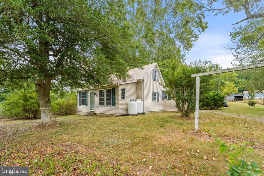 Look no further, here's an affordable farmette for you!! Hudson Mills Farm has 7.32 acre mostly open acres. Plenty of room for horses, goats, or whatever you want. The home has three(possibly 4) bedrooms and 1 full bath, eat-in kitchen, living room, larger dining area, two bedrooms on main level and a finished sunroom. Upstairs is another bedroom and possible fourth bedroom or hobby room.....whatever you want. You'll find a large barn that could easily be used for the farm animals.  Several outbuildings. And one out building that was moved from the Bethel Baptist Church! Freshly painted roof!