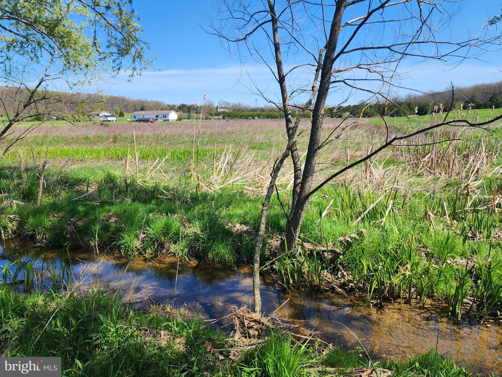 LOCATION,LOCATION,LOCATION! OPEN, FLAT, PERKED, AND USABLE LOT WITH A SMALL STREAM IN THE BACK. LOCATED IN A SMALL AND QUIET SUBDIVISION JUST OUTSIDE OF MOOREFIELD. PUBLIC WATER HOOKUP AVAILABLE AND DOUBLE - WIDES ALLOWED. MINUTES FROM WAL-MART, 4-LANE HIGHWAY ( CORRIDOR-H), MOVIE THEATER, RESTAURANTS, ETC. PRICED RIGHT AND READY FOR SOMEONE TO PUT DOWN ROOTS IN THE MOUNTAIN STATE. CHECK IT OUT TODAY!