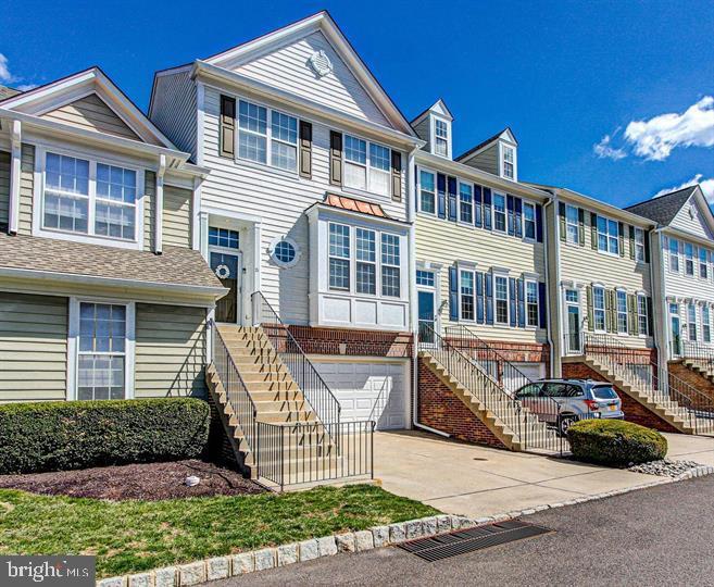 Welcome to 21 Charter Oak Court, a beautifully updated townhome in this highly desirable Doylestown community of Doylestown Station!. This impressive 3 bedroom, 2 full 2 half bath home spans 3 stories including a finished walk out lower level. This stunning home has just been freshly painted in neutral colors, new carpet and flooring! Upon entering, you'll be greeted by a spacious open-concept living area featuring laminate hardwood floors, abundant natural light, and a cozy fireplace – perfect for relaxing or entertaining guests. The modern kitchen is a chef’s dream, equipped with stainless steel appliances, huge center island with granite countertops, and ample cabinet space. Perfect for entertaining. The adjoining dining area flows right into a cozy family room. The deck is right off the family room. It is a great size for a BBQ and relaxing. Upstairs, the master suite offers a tranquil retreat with a large walk-in closet and a luxurious en-suite bathroom featuring a soaking tub and separate shower. Two additional well-sized bedrooms, a full updated spa like bathroom and laundry complete the second floor, providing plenty of space for family and guests. Another high point of this home is the finished basement, complete with a half bath. This versatile space can be used as a family room and home office, gym, or 4th bedroom – the possibilities are endless! Slider doors walk out to a back area. Two car garage and off street parking. This home is very close to Central park which offers playgrounds, athletic fields, walking/running trails and year round community events. All just minutes away from Doylestown’s vibrant downtown area, renowned for its shopping, dining, and cultural attractions. Plus, top-rated Central Bucks schools are just a short drive away. Don’t miss the opportunity to make 21 Charter Oak Court your new home. Schedule a showing today and discover the unmatched space and convenience this townhome offers!