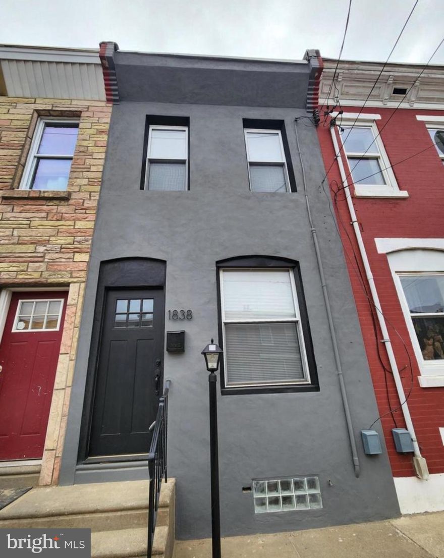 Renovated 3 bed, 1.5 bath straight-thru in East Kensington offering clean, modern finishes throughout and true move-in ready condition. Open living space with exposed brick accent, new flooring, fresh paint, and updated lighting flows into a redesigned kitchen with white shaker cabinets, butcher block countertops, stainless steel appliances, and custom backsplash. First floor bedroom adds flexibility for layout or office use. Upstairs features two spacious bedrooms and a fully updated bath with custom tile. Fully finished basement adds additional living space perfect for den, office, or storage. Major systems already handled with newer HVAC and hot water heater. Private rear yard for outdoor space. Currently tenant occupied at $1,400/month providing immediate cash flow, with the option to deliver vacant if desired. Located in a rapidly developing pocket surrounded by new construction, walkable to local spots and with easy access to Center City and transit. Strong option for both owner-occupants and investors looking to get into 19125 at an accessible price point. Some photos are AI enhanced. Photos are from previous listing.