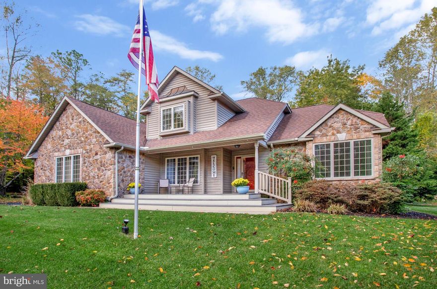 Welcome to this inviting home on a quiet cul-de-sac in Saint Leonard. The highlight is a dramatic two-story family room with floor-to-ceiling windows and a cozy two-sided fireplace that opens to the kitchen. The first-floor primary suite offers convenience with its own private bath, while upstairs you’ll find additional spacious bedrooms. The finished section of the basement adds flexibility with a dedicated home office and bonus living space while leaving the rest of the basement to be completed based on your needs. Outside, enjoy a large deck and yard perfect for relaxing or entertaining. Conveniently located just minutes from shops, schools, and Chesapeake Bay attractions along with being an easy commute to Joint Base Andrews, Patuxent Naval Base, Coast Guard Headquarters and DC.