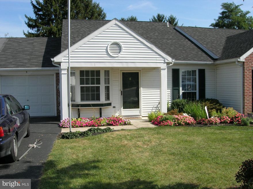 Come explore this captivating combination of impeccable style and appealing updates that speaks for itself. Modern, yet comfortable and cozy two bedroom ranch on slab, so leave your shoes at the entry door and come in to a beautiful, inviting "like new" home with one level living. The amazing cathedral ceilings span from the cozy front living room, up over the centrally located eat in kitchen and all the way to the rear dining area which overlooks the nicely manicured and treed lawn in the rear yard. New laminate floors, new stainless kitchen appliances make this kitchen and main living area very inviting. New bathroom double sink vanity. Relax on the small rear deck where you will love watching the seasons change with their cascade of colors against the changing skies. The laundry is conveniently located right off the kitchen and the existing washer and electric dryer together with the refrigerator, range, microwave, and dishwasher are included. Two parking spots are located at your front door, along with the oversized one car heated garage with workspace and upper shelving for extra storage. Easy access to US RT 11, 15 and I-81 North and South, and just minutes from the PA Turnpike and I-83. Gettysburg is south, Hershey is east and the State Capitol is just across the Susquehanna River. You will not want to miss this rare opportunity in CV Schools and Silver Spring Township to experience convenience, comfort, easy access to the surrounding area, with its abundant employment, recreation, and medical facilities. Regardless of whether you are just starting out or downsizing this could be the right 2 bedroom home at the right time for you.  Available May  2025.