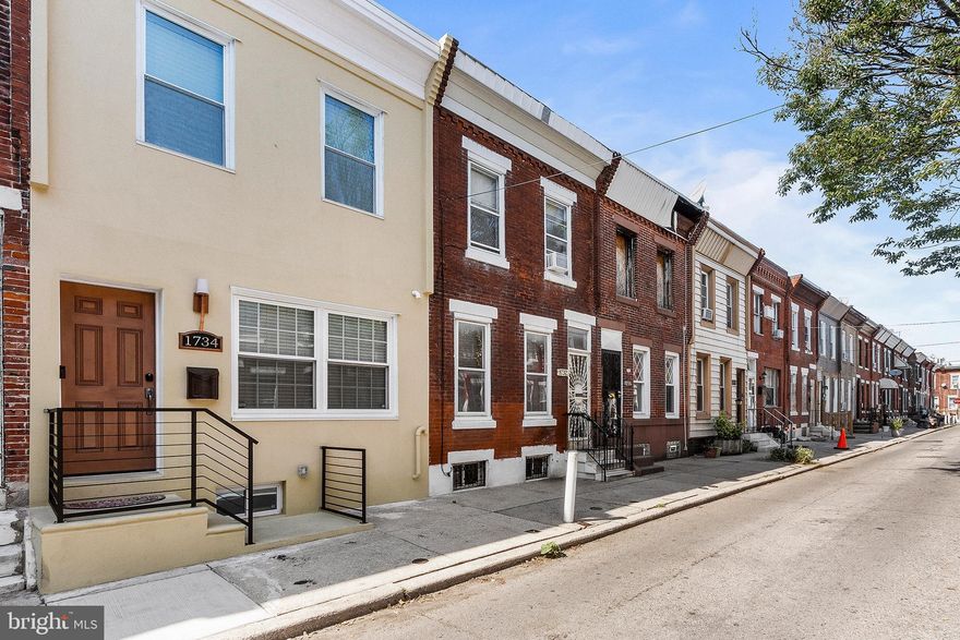This fabulous 2019 renovated home is located in Point Breeze just outside the west end of Newbold! When you first walk in your eye is immediately drawn to the exposed brick wall and stunning custom fireplace! As you make your way to the dining room you will see your back door which leads you to your own private outdoor oasis. At the back of the home you will find a kitchen with a gorgeous copper farmhouse sink, quartz countertops, and stainless steel appliances. Make your way upstairs and you will find the first bedroom large enough for a queen size bed. Next you’ll find the WiFi connected Samsung washer and dryer followed by a full-bath with frameless glass tub. Continue down to the master bedroom with it’s own en suite bathroom. This en suite bathroom has a sliding barn door, exposed brick, skylight allowing in tons of natural light and a curved glass shower with shower column to help you unwind after a long day! Make your way to the finished basement and you will see that the builder who renovated the home has dug out the basement to allow for 7.5’ ceilings and added a half bathroom! Some additional features to note about this home are a tankless water heater, newer HVAC, Ecobee smart thermostat, WiFi light switches, ADT alarm system with door / window sensors, glass break sensors, motion, CO2 & fire alarms, Ring front doorbell, Ring flood light with camera at back door, Amazon Key camera, and smart door locks. Close to restaurants  like Tap Room on 19th, American Sardine Bar, Burg's Hideaway, SEPTA, and many others! Make your appointment today!