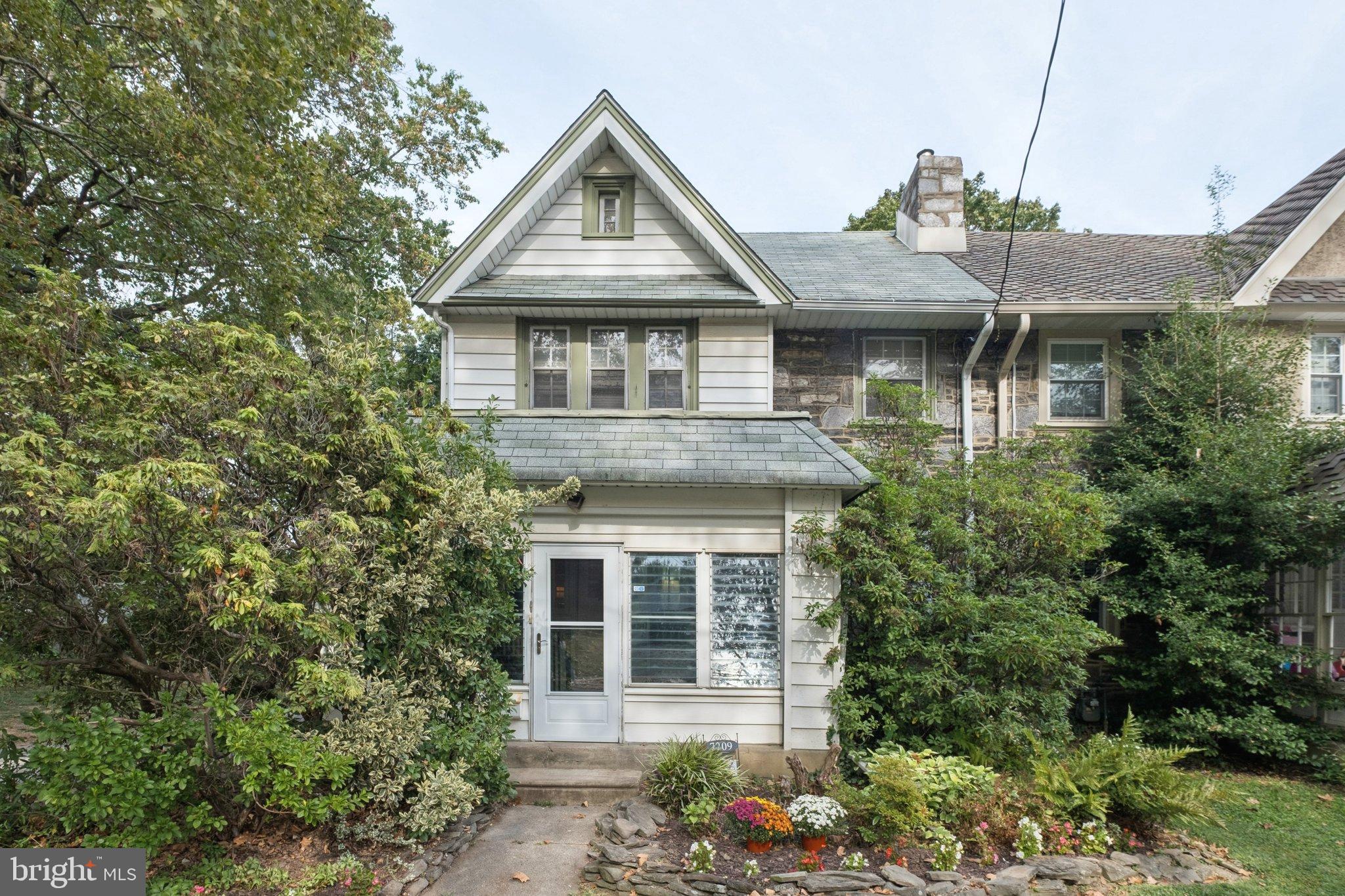 Welcome to this classic Upper Darby twin in a friendly, sidewalk-lined neighborhood. A private driveway, detached garage, and front yard with flower beds set the scene.
Inside, hardwood floors run through the main level. The enclosed porch works year-round with glass or screens, and the cozy living room features a stone wood-burning fireplace plus two coat closets. The dining room offers a built-in corner hutch and sliders to a full-width deck overlooking the private backyard. The kitchen has granite counters, solid wood cabinets, and stainless appliances (GE fridge and dishwasher, Whirlpool stove).
Up 3 stairs, a powder room is convenient for guests, and then more stairs lead to three bedrooms and a full hall bath. The primary includes a deep closet and walk-up attic access (could be finished for the future). The hall linen closet is extra deep, and the full bath is spacious with classic black-and-white tile, wide vanity, tub/shower, and window. The basement offers high ceilings, laundry with washer/dryer, utility sink, walk-out access, and even a bonus toilet—plus plenty of space to finish if desired. This home blends comfort, character, and practicality, all in a welcoming Upper Darby location.