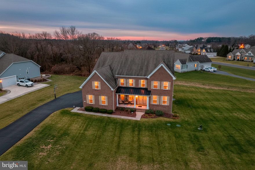 Price Reduced! Welcome to this like-new, meticulously maintained estate in the heart of Townsend Fields, nestled within the highly sought-after Caesar Rodney School District. Just seven years young and showing like a model home, this stunning property offers over 6,600 square feet of beautifully finished living space where timeless design meets modern luxury.
From the grand oversized foyer to the gourmet kitchen featuring white cabinetry, quartz countertops, and stainless steel appliances, every detail has been thoughtfully curated. The main level flows effortlessly between formal and casual spaces, complete with a sun-filled sunroom and private home office. Upstairs, the breathtaking primary suite impresses with a double-sided fireplace, spa-inspired marble bath, and generous walk-in closet — a true retreat. Three additional bedrooms, including a princess suite with its own full bath, complete the upper level. The fully finished basement adds even more versatility with a recreation area, full bath, and bonus bedroom. Outside, a gazebo-style deck overlooks a beautifully maintained yard — perfect for entertaining or unwinding. This is exceptional, move-in ready luxury at its finest. Schedule your private tour today!