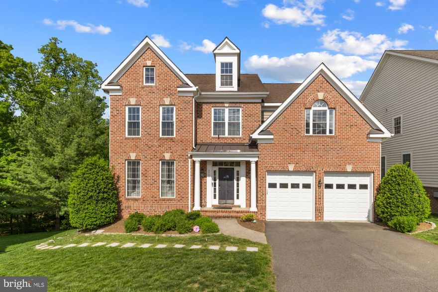 Welcome to this exquisite brick front single-family home located in the highly sought-after Morgan Chase community, just 5 minutes from Tysons Corner! Spanning nearly 6,000 sqft across three levels, this meticulously maintained residence features 5 spacious bedrooms and 4.5 bathrooms, making it ideal for comfortable living. Step inside to discover gleaming hardwood floors and recessed lighting throughout the main level. The desirable floor plan includes formal living and dining rooms, along with a gourmet kitchen boasting a generous center island, double oven, and a five-burner stovetop—perfect for culinary enthusiasts. The expansive family room, complete with a cozy gas fireplace, and a main level office make it an ideal space for both relaxation and productivity, especially for those who work from home. The upper level presents four large bedrooms, each equipped with walk-in closets. The luxurious owner’s suite offers a formal sitting area, two walk-in closets, and an opulent spa-like bathroom featuring a large soaking tub and a separate walk-in shower. Upper level laundry room provides convenience .The fully finished basement hosts a fifth bedroom, perfectly sized for an in-law suite, complete with patio doors and windows for natural light. Enjoy entertaining in the expansive recreation area, which includes a custom-built bar, projector, and audio systems that convey with the home. A spacious patio door leads to a newly added stone patio—perfect for outdoor gatherings. Additional highlights include fresh paint, a new furnace, and recently replaced windows. This home is conveniently located near Loring metro stations, Tysons shopping, and the W&OD trail. The HOA covers lawn and tree maintenance, making home upkeep a breeze. Don’t miss out on this rare find with thoughtful upgrades and features designed for enjoyable living in a prime location!