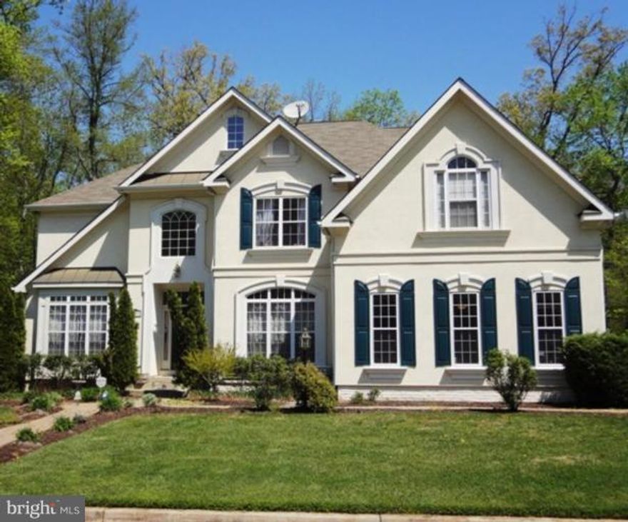 Distinctive Custom Estate - New Home Condition - 2.5 wooded acres in private setting adjacent to Golf Course with easy access to DC & Baltimore via 495, 295 & 50, and mins to NASA. 3-car garage & Hardwood floors throughout this exceptional home. New kitchen with granite and Electrolux double oven, remodeled bathrooms; deck & patio with fire pit and pond. Great for entertaining and priced to sell!