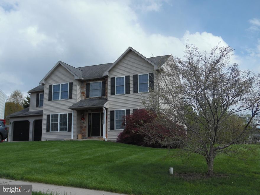 Welcome home to this well-maintained colonial in Pleasant Meadows, which is located on a large, corner lot which backs to a wooded tree line. This house has been freshly painted through-out in a neutral white tone, has new vinyl plank flooring on the first level and a brand-new heater and central air unit. Traditional center hall floor plan with foyer, living room, dining room, kitchen, family room, powder room, laundry closet and interior access to the garage area. Bright, modern eat-in kitchen with white cabinets, granite countertops, black appliances and ceramic tile backsplash. Breakfast area with sliding glass doors lead to the rear concrete patio with gazebo. Second floor has wall to wall carpeting and three (3) ample sized bedrooms and hall bath.  Owner's suite has a large, walk-in closet, double door closet and separate vanity and sink area outside of the full bathroom. Finished basement area has a large recreational room, separate bonus room that is used as a home office, storage closets and a powder room. This level has laminate flooring, recessed lighting and a powder room. Come make this home yours and envision yourself enjoying all the interior and exterior amenities it has to offer.
